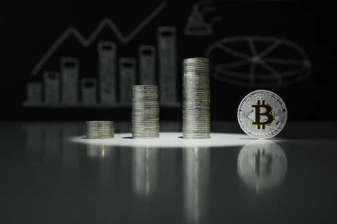 Stacks of silver bitoyins. Crypto currency. BTC. Virtual currency Stock Photos