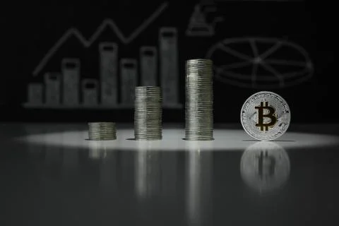 Stacks of silver bitoyins. Crypto currency. BTC. Virtual currency Stock Photos
