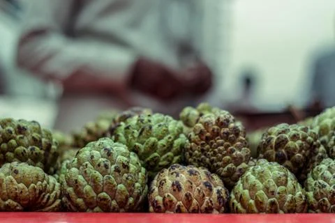 Stacks of sugar apple or custard apple at the traditional marketplace in Delh Stock-Fotos