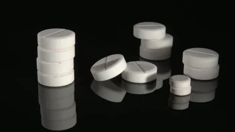 Stacks of tablets close up on a black background. 스톡 동영상 146727796