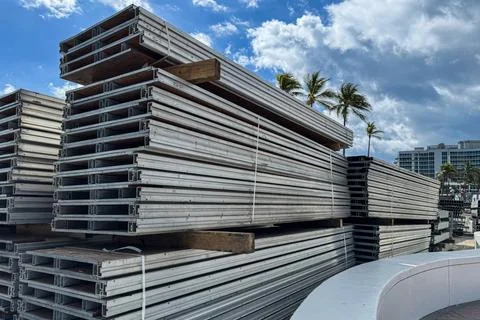 Stacks of temporary seating sit ready for assembly on beach Stock Photos