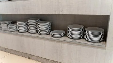 Stacks of White Ceramic Plates on Shelf in Restaurant Buffet Area Stock Photos