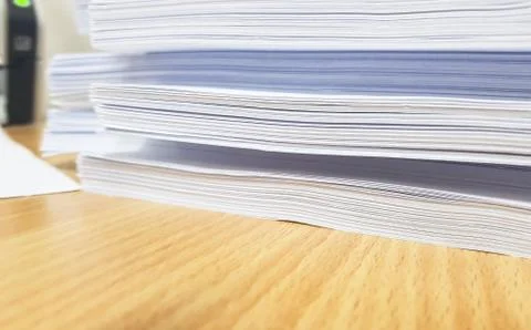 Stacks of white paper document on brown table,design for Illustration banner  Stock Photos