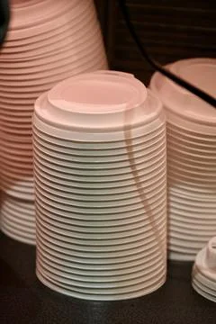 Stacks of White Plastic Disposable Coffee Cup Lids 写真素材