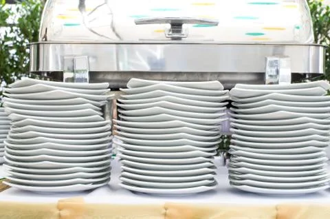 Stacks of white plates for a buffet Stock Photos