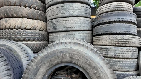 Stacks of worn tires fill the frame Stock Footage 345145114