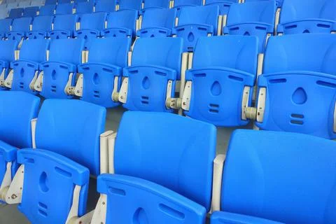 Stadium chair pattern.Blue chair pattern.Empty bright blue stadium seats.A ro Stock Photos