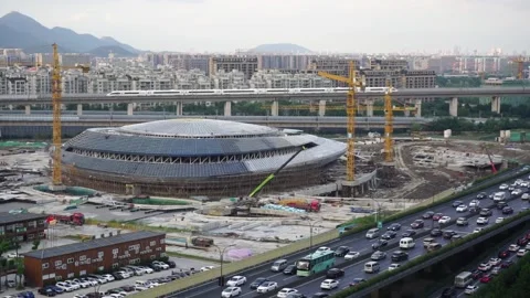 Stadium construction site, road, train, mountain for Olympics, Hangzhou, China Stock Footage 160788116