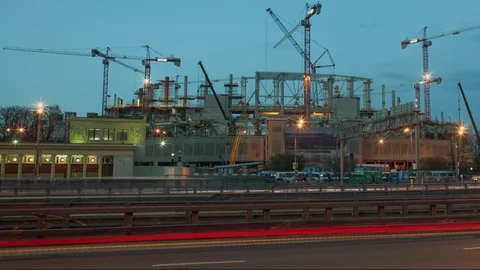 Stadium construction timelapse, cranes at work, urban traffic, industrial Stock Footage 90869902