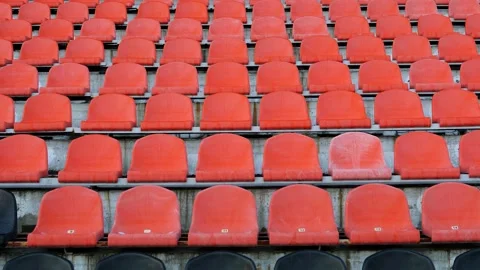 Stadium, empty plastic seats in the stadium before a game or during the COVID-19 Video stock 165134050