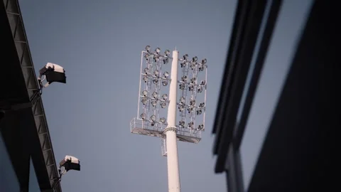 Stadium Floodlight Towers Seen from Below Stock Footage 341872673