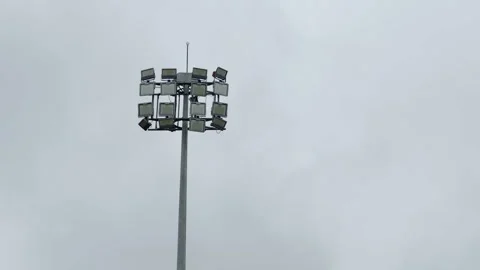 Stadium Floodlights Against Overcast Sky for Outdoor Sports Venue Stock Footage 344583057