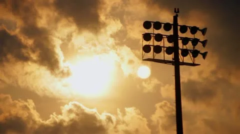 Stadium Light Silhouette in Front of Clouds 2 Stock-Footage 12592828