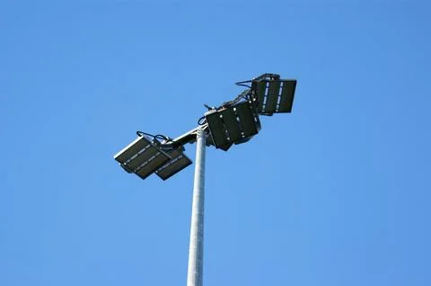 Stadium lighting lantern on sky background Stock Photos