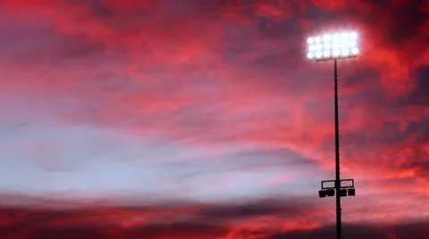 Stadium Lights Against Burning Sky Stock Footage 51674539