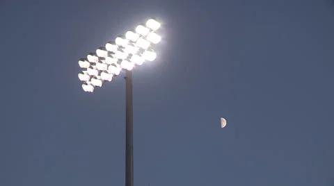 Stadium lights with moon in background Stock Footage 41793923