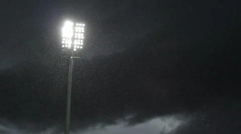 Stadium lights stand in the late evening, raining Stock Footage 52016708