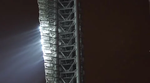 Stadium lights turned on in fog night Stock Footage