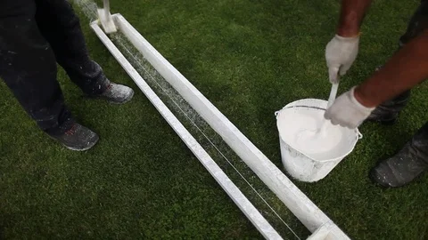 Stadium staff does markings of a football field. Video stock 70953053