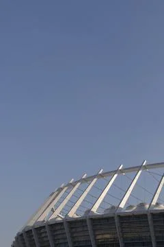 Stadium structure against a blue sky background Stock Photos