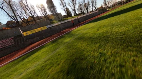 On the stadium two young athletes performing cardio workout. Couple male and Stock Footage 167926624