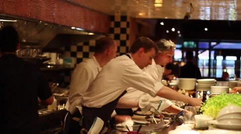 Staff and chef at open kitchen chic sushi bar Stock Footage 41984122