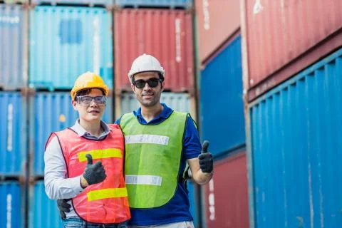 Staff and foreman control loading container cargo working team happy enjoy wo Stock Photos