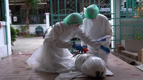Staff are packing dead bodies from an outbreak of the COVID-19 virus. Stock Footage