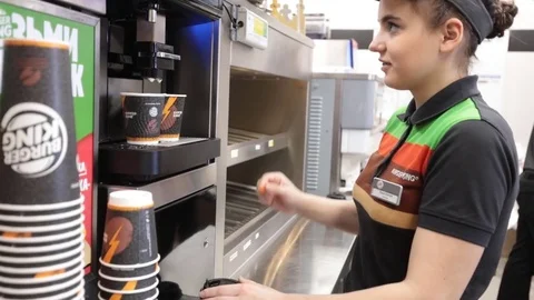 Staff of Burger King restaurant preparing coffee Video stock 83008129