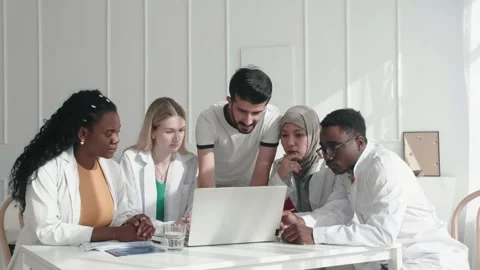 Staff, doctors and nurses with laptop, research and brainstorming for diagnosis Stock Footage 250525760