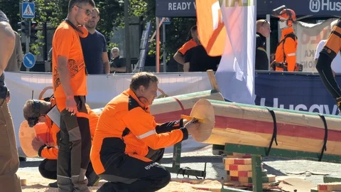 A staff measuring the log after the cut in Rakvere Estonia Stock Footage 121087762