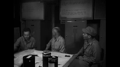 Staff officers plot progress of Okinawa operation using charts and operations Vídeos de archivo 117053827