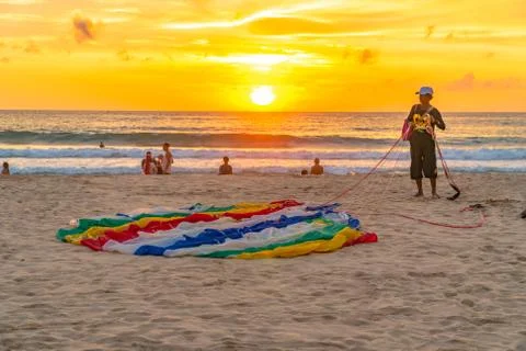 A staff pulling parasail on the beach Stock Photos