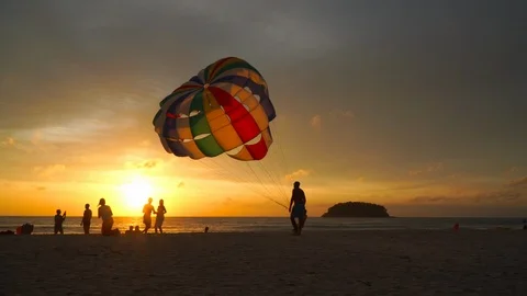 A staff pulling parasail Stock Footage 120007842