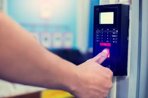 Staff push down electronic control machine with finger scan to access the doo Stock Photos