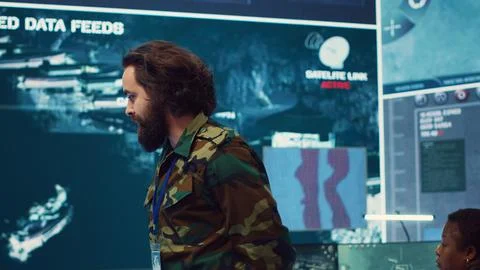Staff sergeant briefing his army troops crew with details of a new mission 库存照片