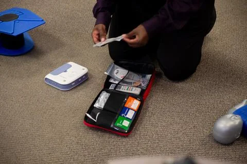 Staff setting AED machine to practice first aid Stock Photos