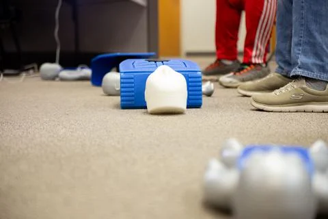 Staff setting AED machine to practice first aid Stock Photos