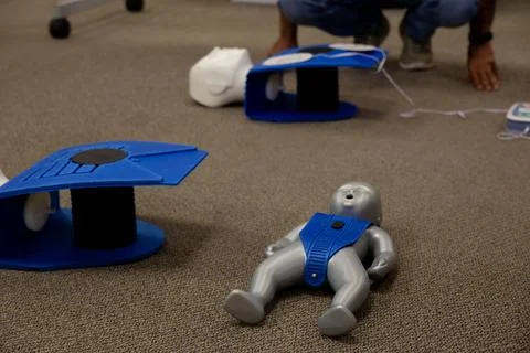 Staff setting AED machine to practice first aid Stock Photos