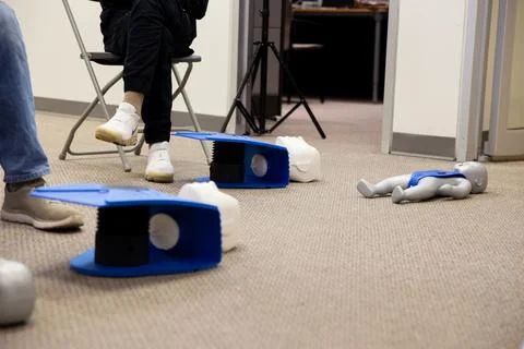 Staff setting AED machine to practice first aid Stock Photos