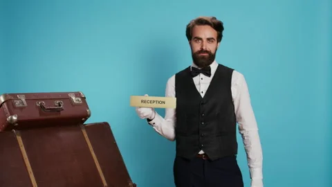 Staff shows reception pointer on camera Stock Footage 249773064