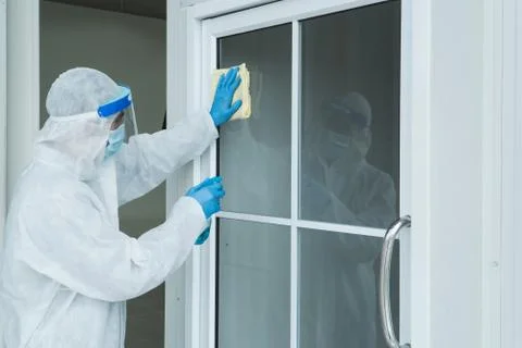 Staff is spraying disinfectant and wiping clean Stock Photos