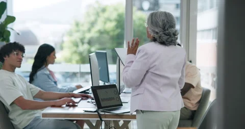 Staff, talking or manager with paperwork in digital agency,  project briefing or Stock Footage 329402215