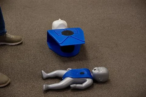 Staff training for CPR first aid with the AED. Stock Photos