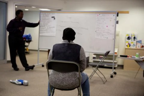 Staff training for CPR first aid with the AED. Stock Photos