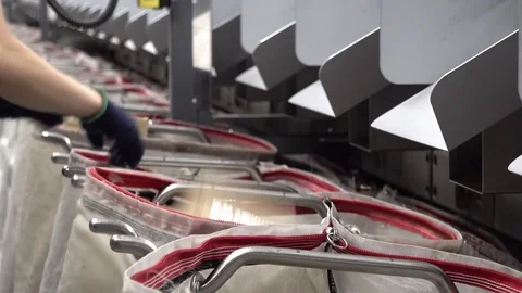 Staff working at the automated parcel sorting system filling bags Stock Footage 83599711