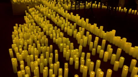 A stage with 100's of candles, moving towards the left Stock Footage 243370982
