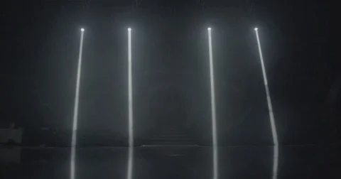 Stage beam lights in tv set studio black and white Stock Footage 80179954