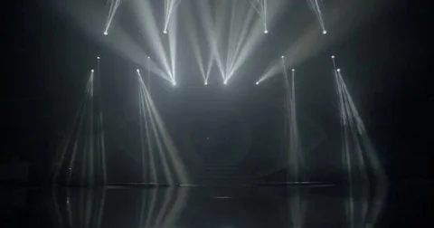 Stage beam lights in tv set studio colours Stock Footage 80181854