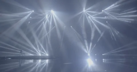 Stage beam lights in tv set studio colours Stock Footage 80191944